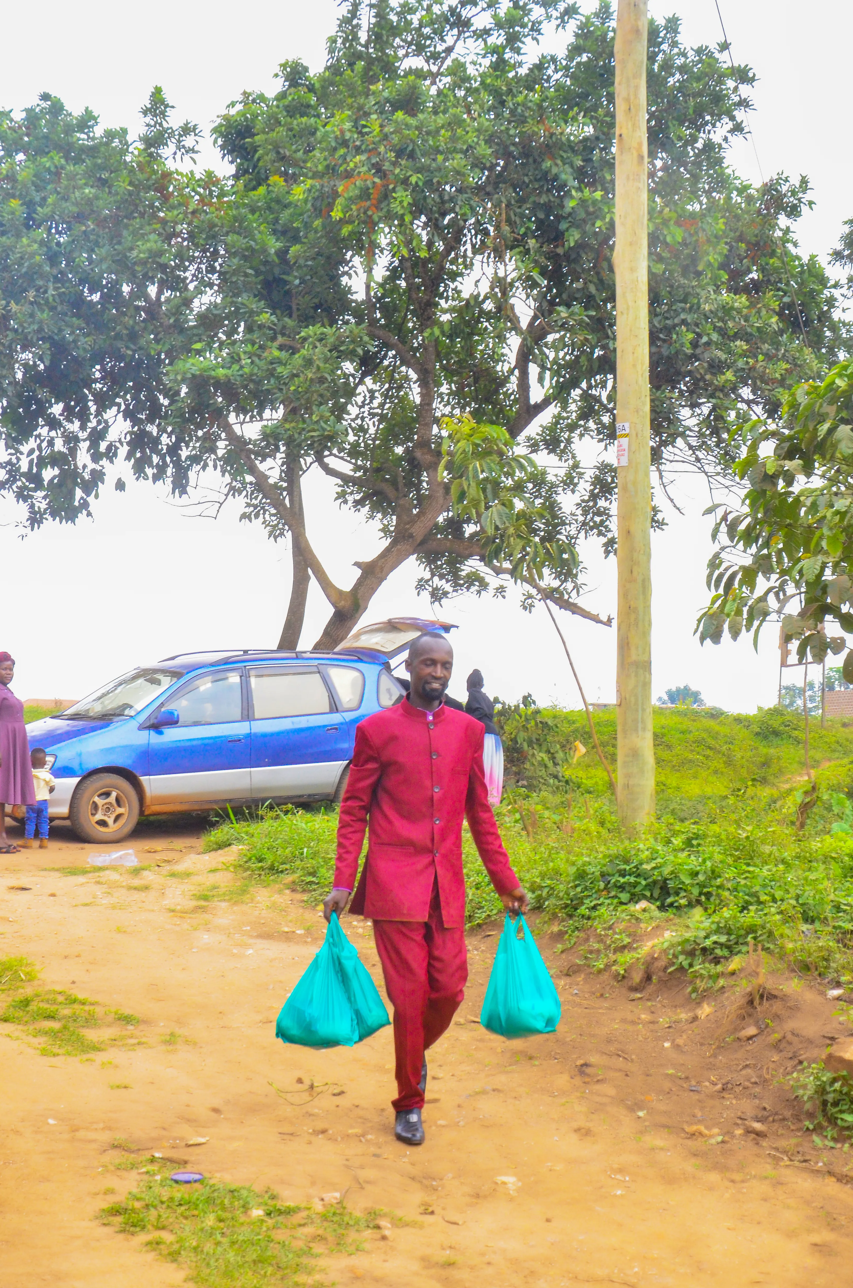 A pastor on outreach with supply packages